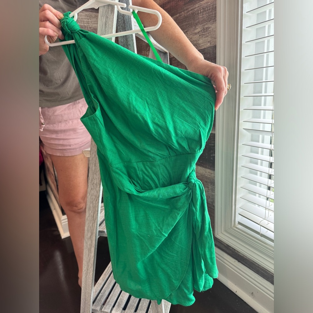 One shoulder green dress.